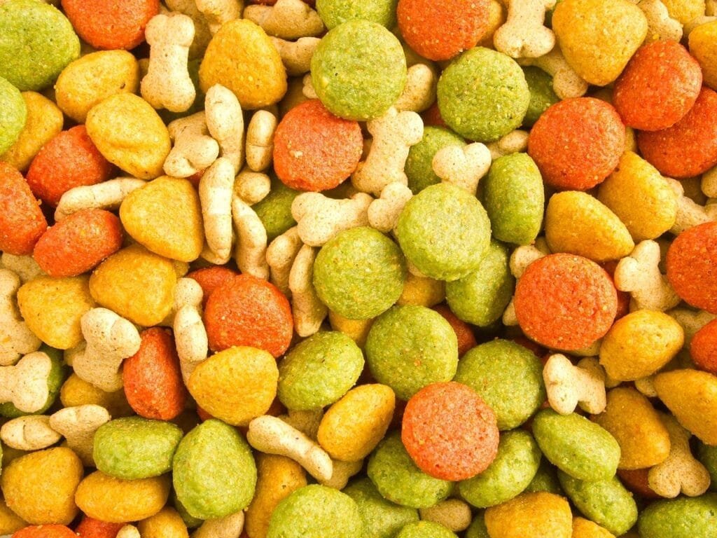 Colorful dog treats displayed as part of a balanced approach to dog nutrition, highlighting healthy snacking options for pets.