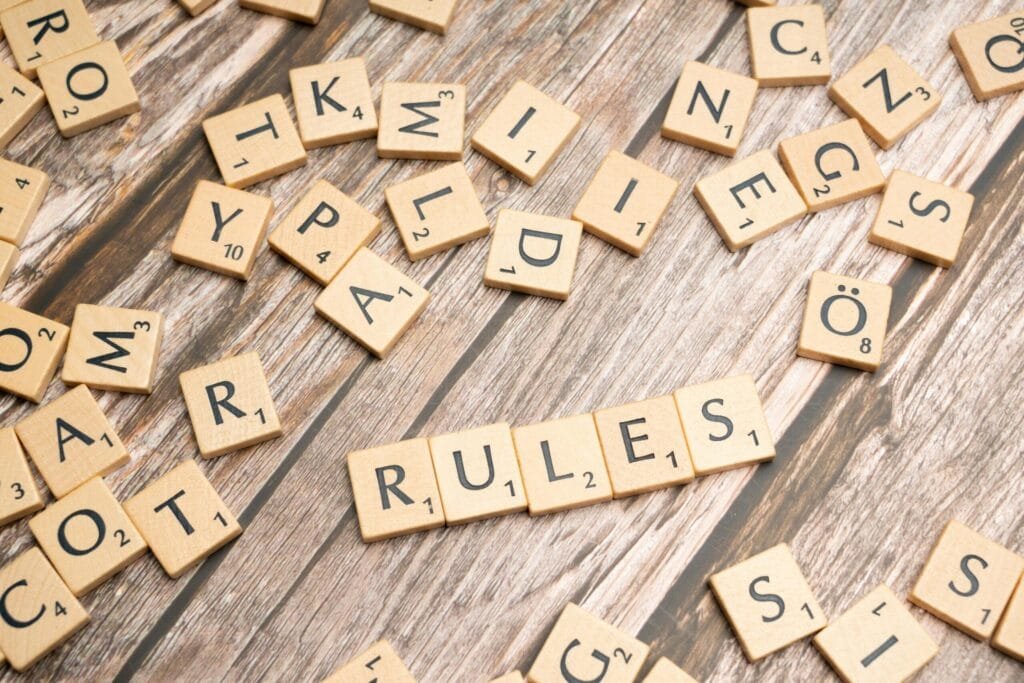 What Is the 777 Rule for Dogs? 2 scrabble letters spelling rules on a wooden table